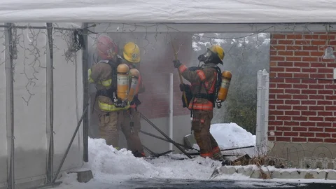 Firemen working on house fire Stock Footage 103301515