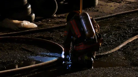 Firemen working with multiple hoses Video stock 114757994