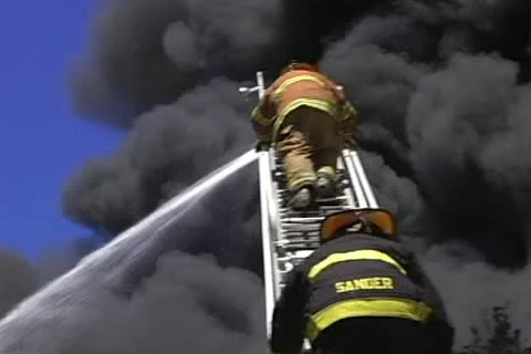Firemen working on recycling facility fire Stock Footage 16003128