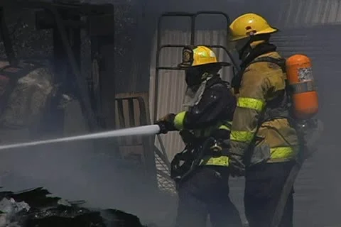 Firemen working on recycling facility fire 008 Stock Footage 16015684