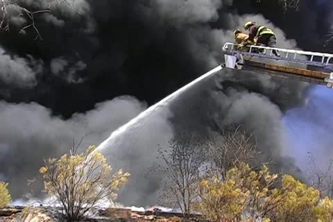 Firemen working on recycling facility fire 004 Stock Footage 16221228