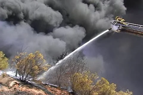 Firemen working on recycling facility fire 002 Stock Footage 16221748