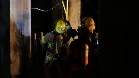 Firemen working in the roof Stock Footage 114757475