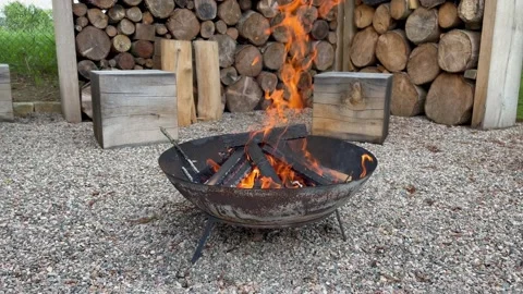 Firepit with burning wood outdoors. BBQ place at the yard Stock Footage 207691414