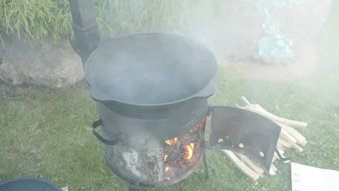 Fireplace and large cauldron preparing for cooking Video stock 131541748