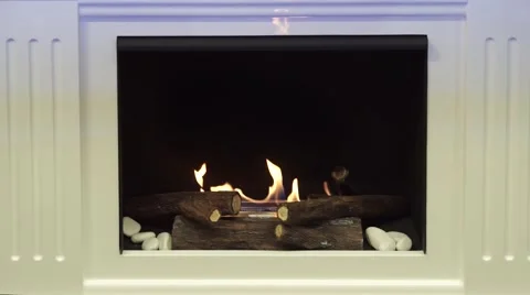 Fireplace with artificial ceramic log wood fire Stock Footage 64801690