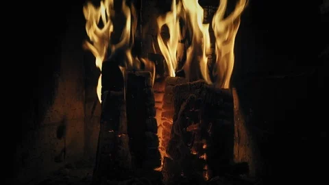 Fireplace burning closeup. Cozy warm burning fire in a brick fireplace. Cozy Stock Footage 86727126