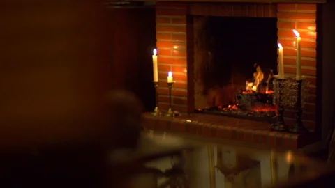 Fireplace burning, cozy situation with a rustic household, brick decor Video stock 88791331