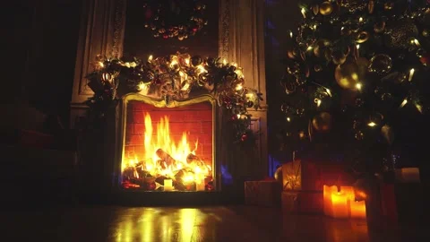 Fireplace with burning fire. Christmas and New Year interior decoration. Gree Stock Footage 164931790