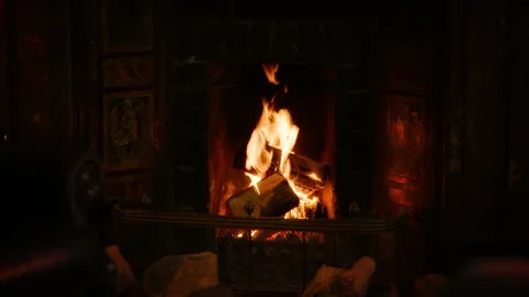Fireplace with burning logs at night Stock Footage 304996376