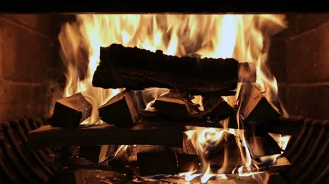 Fireplace burning. Warm cozy burning fire in a brick fireplace close up. Stock Footage 68978736