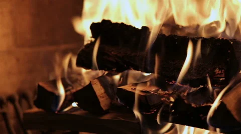 Fireplace burning. Warm cozy burning fire in a brick fireplace close up. Stock Footage 68978990