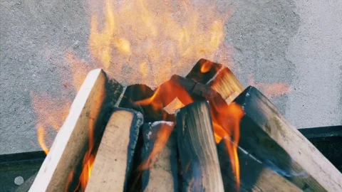 Fireplace burning. Warm cozy burning fire in a brick fireplace close up. Video stock 71129421