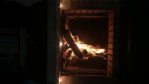 Fireplace burning in a winter - vertical video. Stock Footage 142157672