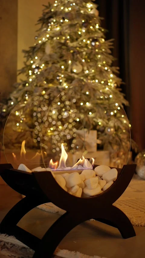 Fireplace with Christmas tree in background. Concept of Christmas decorations. Stock Footage 294042684