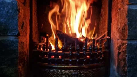 Fireplace close-up on a cold day with a blazing fire Stock Footage 325511734