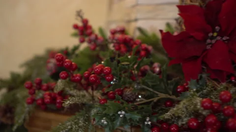 The fireplace is decorated with Christmas tree branches with viburnum berries Stock Footage 166594422