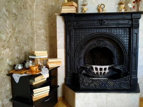 Fireplace with an empty photo frame on it Stock Photos