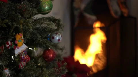 Fireplace with fire and Christmas Tree Video stock 145375090