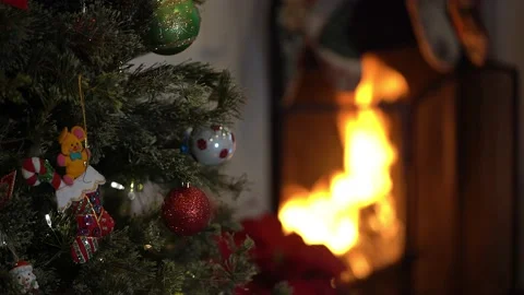 Fireplace with fire and Christmas Tree Video stock 145375091