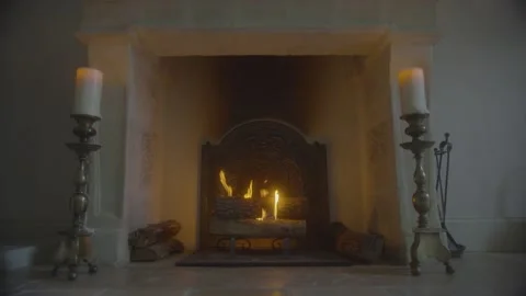 Fireplace in an old authentic fireplace with candles around Stock Footage 229560583