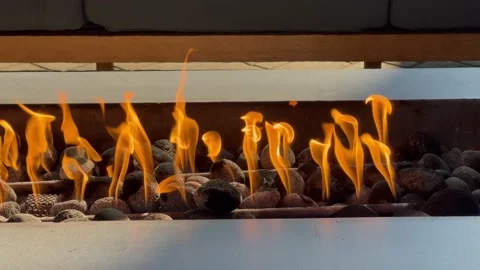 Fireplace outdoor closeup. Large built-in gas fireplace closeup. Cozy place for Stock Footage 239967526