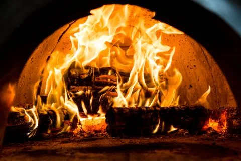 Fireplace with red hot fire Stock Photos