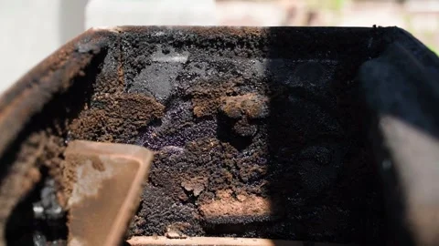 The fireplace stove is covered with soot from the inside after the heating Stock Footage 308403767