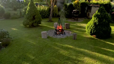 Fireplace in summer in the yard. The smoke is coming up. Aerial view Stock Footage 205064853