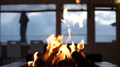 Fireplace on a table at a beachclub - Medium Stock Footage 56284763