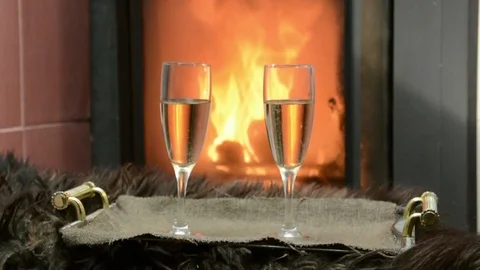 By the fireplace two glasses with champagne Stock Footage 72240097