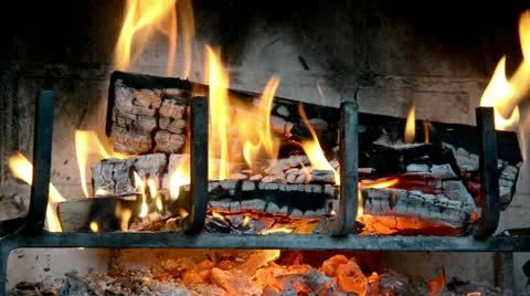 FireplacRoaring fire in a fireplace.e3 Stock-Footage 18095402