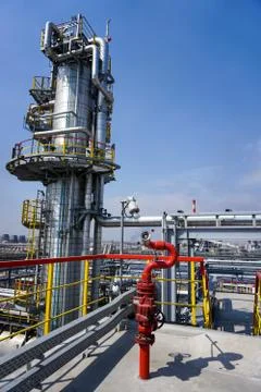Fireplug to extinguish the fire against the background of the oil column at t Stock Photos