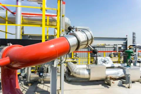 Fireplug to put out a fire against the background of an installation at an oi Stock Photos