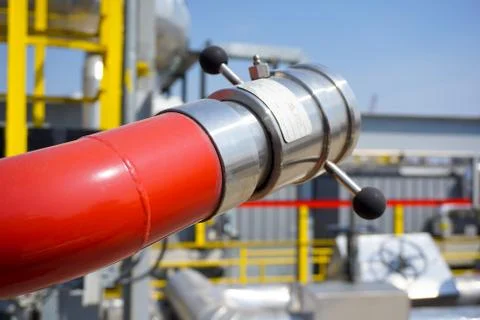 Fireplug to put out a fire against the background of an installation at an oi Stock Photos