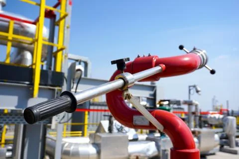 Fireplug to put out a fire against the background of an installation at an oi Stock Photos