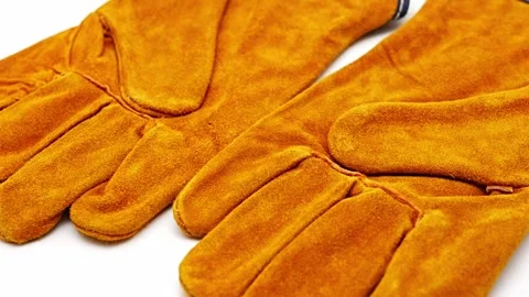 Fireproof gloves shown from multiple angles on a white surface Video stock 329969800