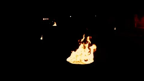 In the fires of bonfires on a black background Stock Footage 84548599