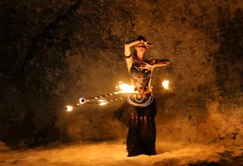 Fireshow artist dancing with fire ring Stock Photos