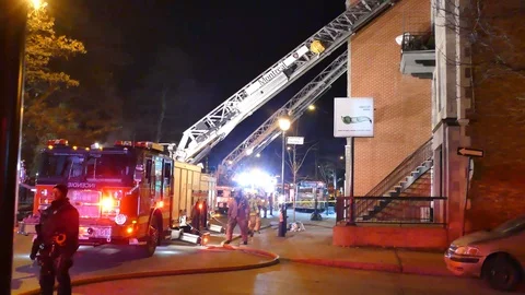 Firetruck with ladder deployed at night Stock Footage 89523120
