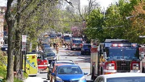 Firetruck leaving fire scene Stock Footage 90336931