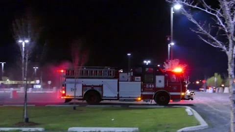 Firetruck with lights passing Stock Footage 139658752