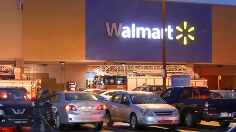 Firetruck with lights ON pulling up at Walmart store in the evening with snow Video stock 104226597