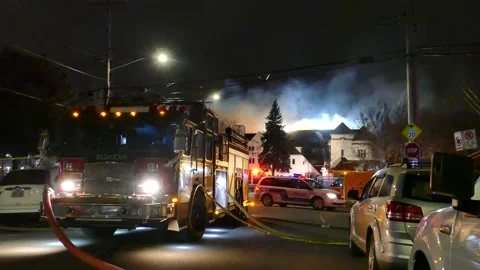 Firetruck at massive structure fire Stock Footage 139657557