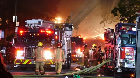 Firetruck moving at fire scene Stock Footage 115937776