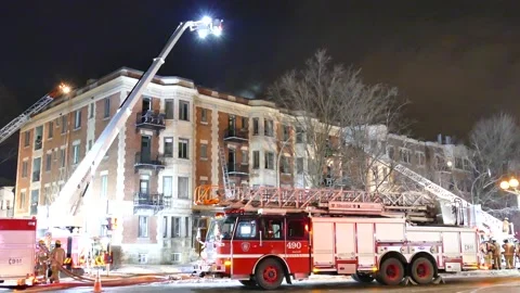 Firetruck at old structure on fire Stock Footage 139663897