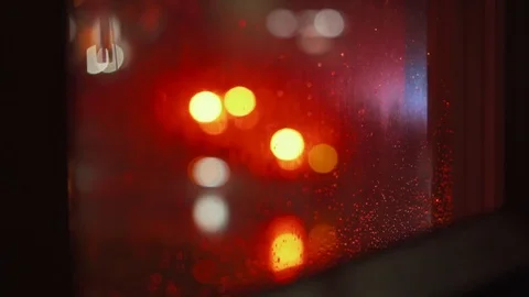 Firetruck Through Window Nightime Raining Out Of Focus.mp4 Stockbeeldmateriaal 104466327