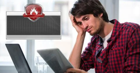 Firewall security protection shield with blank box and man on computer Stock Photos