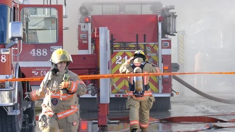 Firewoman during structure fire Stock Footage 105175799