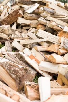Firewood background - chopped firewood on a stack. Dry chopped firewood logs  Stock Photos